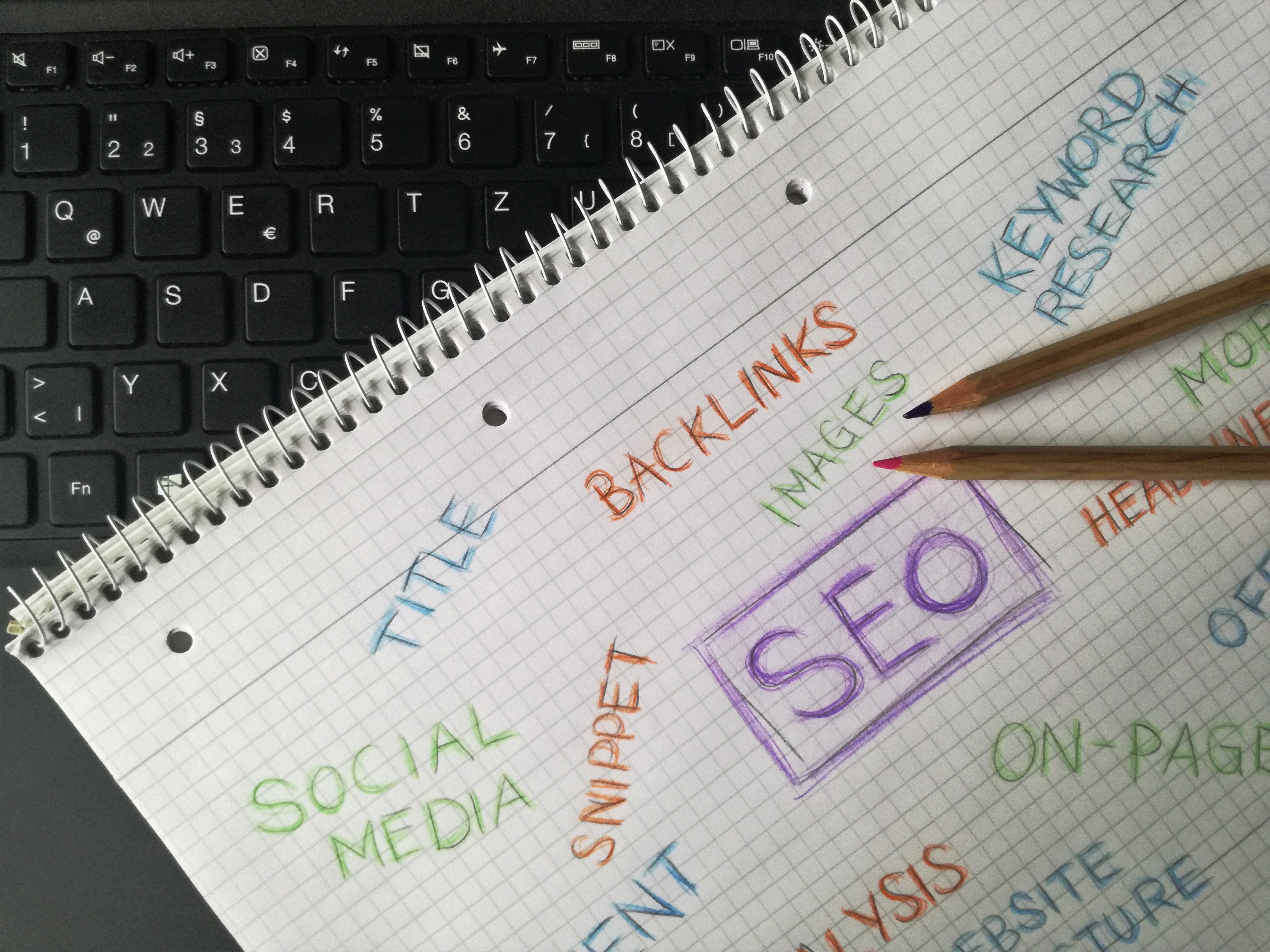 Notebook with SEO keywords and digital marketing strategy notes for backlink building